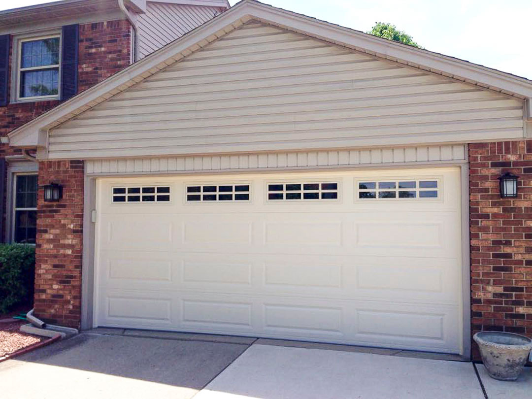 Long Raised Panel shown in Almond with optional Stockton Windows, EZ Open Garage Door